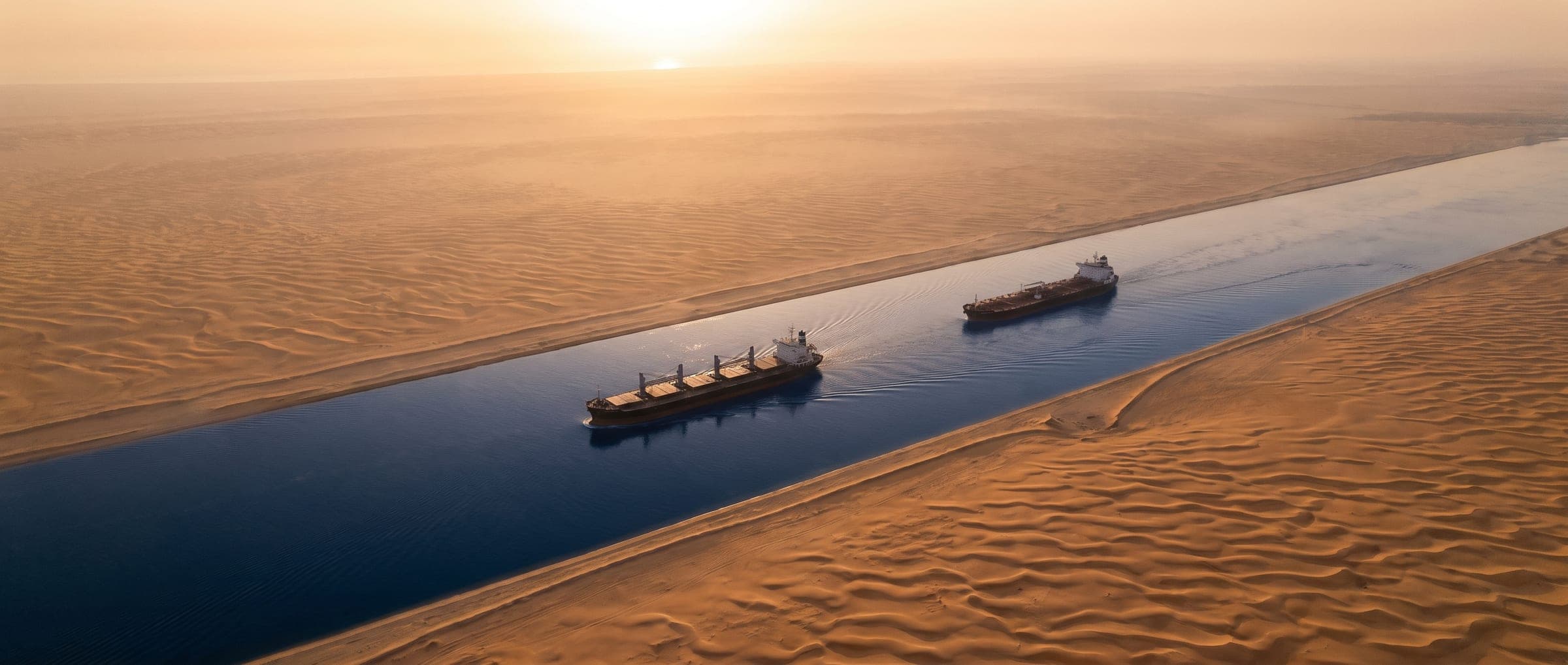 Vessels transiting a desert shipping channel
